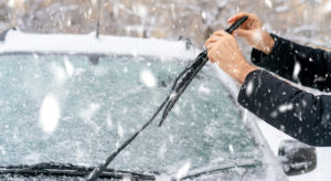 Cleaning snow off of window wipers